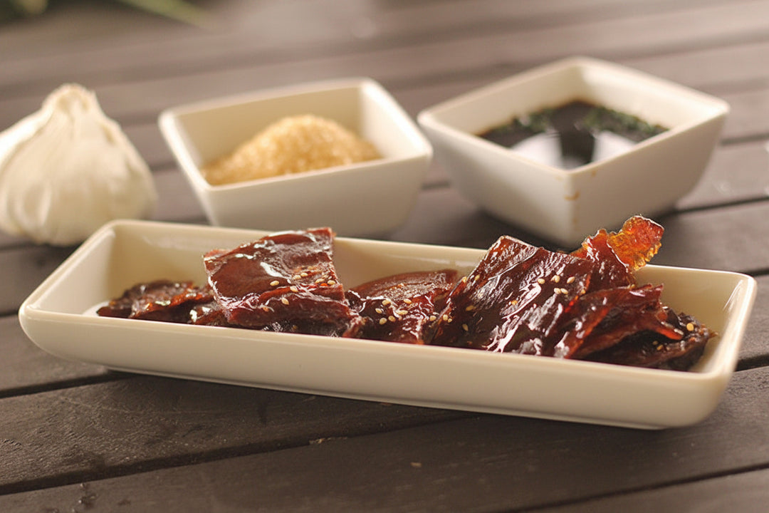 Honey Glazed Ahi in a dish with ingredients in the background